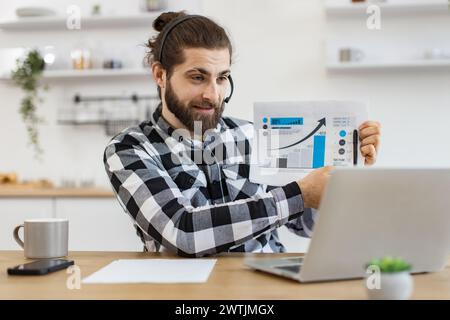 Caucasian worker providing statistical analysis using modern technologies. Stock Photo