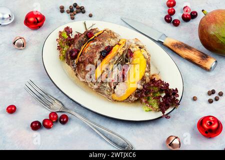Christmas food. Meat roll baked with aromatic mango pieces. Classic meatloaf on a plate. Stock Photo