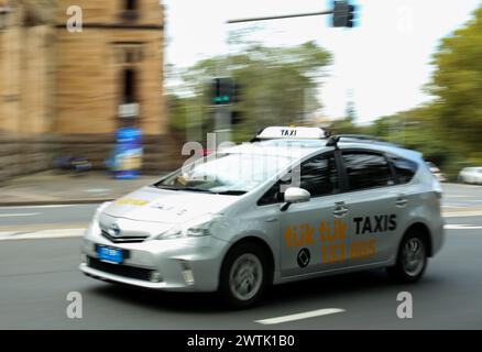 Sydney, Australia. 18th Mar, 2024. A taxi runs on a road in Sydney, Australia, March 18, 2024. After a five-year class action, the ride-sharing giant Uber has agreed to pay 272 million Australian dollars (about 178.5 million U.S. dollars) to compensate taxi drivers in the country for operating services without being licensed. Credit: Ma Ping/Xinhua/Alamy Live News Stock Photo