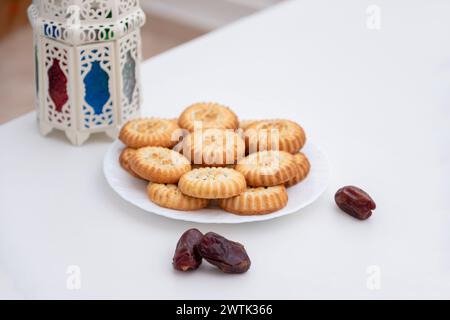 dates kahk eid sweets and fanos on white isolated background Stock Photo