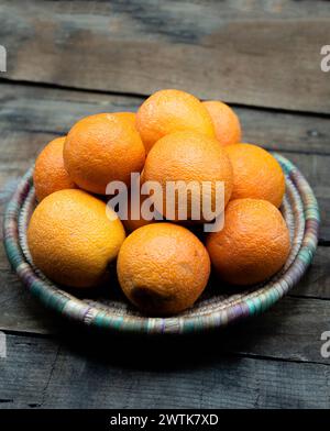 Fresh organic Oranges fruits on wooden Table Stock Photo