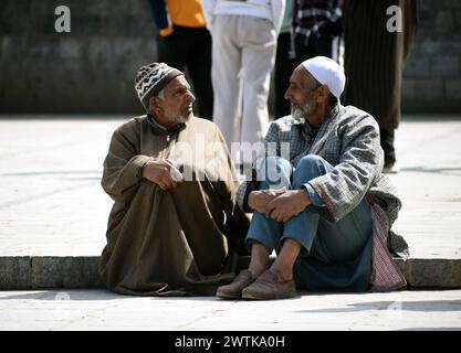 Srinagar, India. 15th Mar, 2024. In Srinagar, Kashmir, India, on March 15, 2024 Elderly men engage in heartfelt conversations while eagerly awaiting Friday prayer at the serene premises of Gard Mosque in Charari Sharief, Budgam district, Srinagar, Kashmir. (Photo by Danish Showkat/Sipa USA) Credit: Sipa USA/Alamy Live News Stock Photo