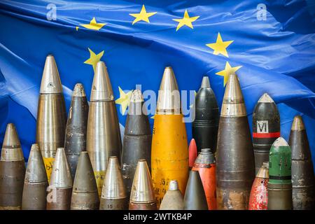 Military bombs and ammunition in front of a waving European Union flag Stock Photo