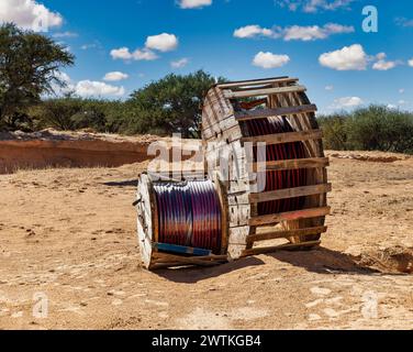 huge roll of industrial cable on a construction site in a sunny summer day Stock Photo