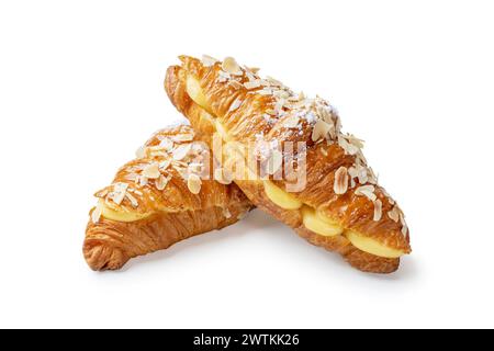 Indulge in the luxurious sight of two croissants filled with aromatic vanilla cream and adorned with crunchy almond flakes, elegantly stacked against Stock Photo