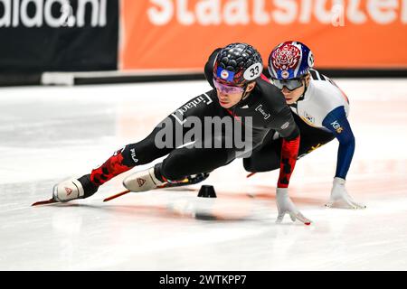 DANDJINOU William CAN leads KIM Gun Woo KOR competing in the 1000m on day 3 during the World Short Track Speed Skating Championship from Rotterdam on 17 March 2024. Photo by Phil Hutchinson. Editorial use only, license required for commercial use. No use in betting, games or a single club/league/player publications. Credit: UK Sports Pics Ltd/Alamy Live News Stock Photo