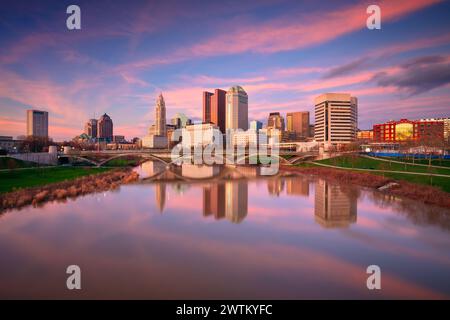 Columbus, Ohio, USA. Cityscape image of Columbus , Ohio, USA downtown skyline with the reflection of the city in the Scioto River at spring sunset. Stock Photo