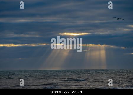 Sunbeams behind storm clouds at Dungeness Stock Photo