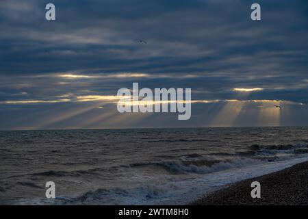 Sunbeams behind storm clouds at Dungeness Stock Photo