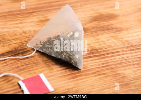 Pyramid tea bag on a wooden background Stock Photo