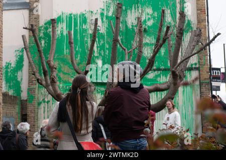 London, UK. 18 Mar 2024. A new mural by street artist Banksy has appeared next to a block of flats in Islington acting as foliage for a tree. The artwork was confirmed by the artist earlier this afternoon as he shared photos on his instagram. Credit: Justin Ng/Alamy Live News Stock Photo