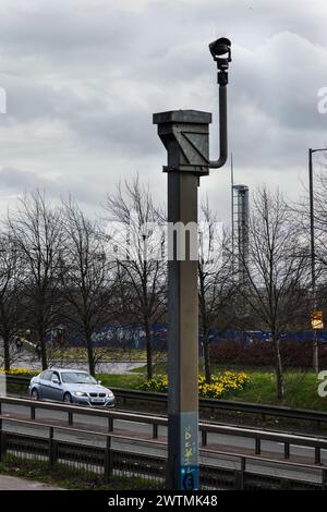 A car drives past a security camera on the Clydeside Expressway, Glasgow, Scotland Stock Photo