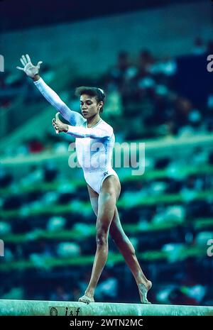 Betty Okino (USA) competing in the women's artistic team all-around ...