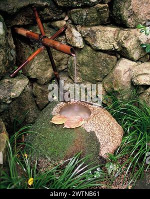 Japan. Kagawa. Kamakura shrine garden. Water source to purify hands. Stock Photo
