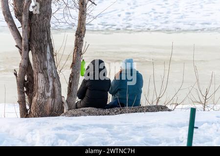 Ordinary life in the city of Samara in winter Residents of the city are sitting on the banks of the winter river Samara Samara region Russia Copyright Stock Photo