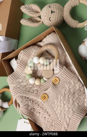 Flat lay composition with different baby accessories on green background Stock Photo