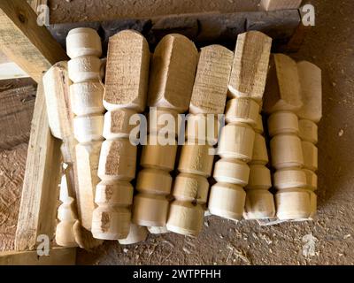 Hand made wooden legs for table and chair in workshop Stock Photo