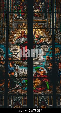 Colorful stained glass depicting the Last Supper of Jesus, with a prominent background image Stock Photo