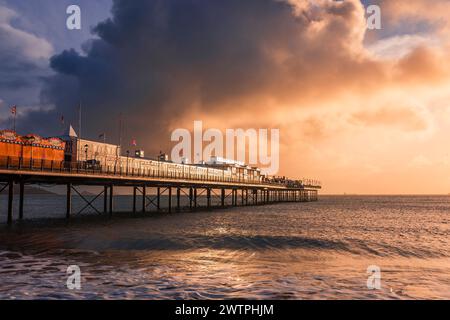 Dramatic storm clouds over Paignton Pier on the Devon coast in west England UK Stock Photo