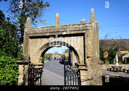 View through the church entrance arch towards the Market House and town centre, Martock, Somerset, UK, Europe. Stock Photo