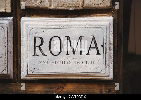 The word Rome and date carved in marble. Italy Stock Photo