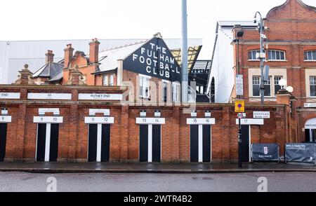 The Putney End of Craven Cottage football ground home of Fulham FC and turnstiles seen from the local streets around West London UK Stock Photo