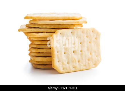 A pile of crackers stacked on a plain white surface. Isolated on white background. Stock Photo