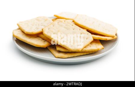 Crackers on a plate. Isolated on white background. Stock Photo