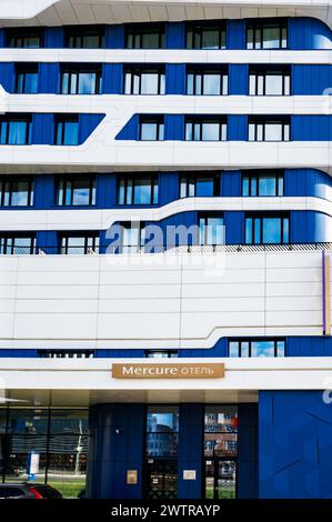 Saransk, Mordovia, Russia. June 4, 2023. The facade of the Mercury Hotel in the center of Saransk. The hotel building rises into the clouds. Stock Photo