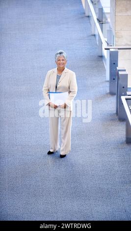 Happy, senior and portrait of woman in office for business, professional or project manager. Executive, top view and female person in workplace for Stock Photo
