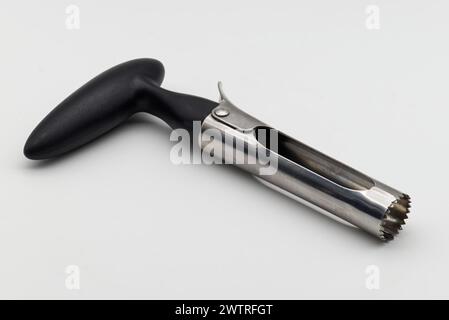 Apple corer. Tool for removing the apple core on white background. Stock Photo