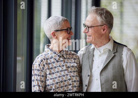Happy senior couple looking at each other at home Stock Photo
