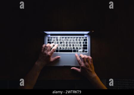 Top view of man hand using laptop at late night. Stock Photo