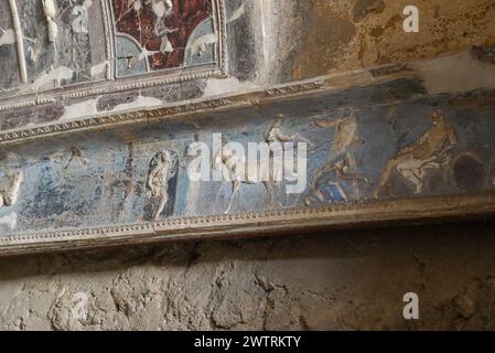 Frescos and sculptures in a roman house in the ancient city of Pompeii, Naples, Italy Stock Photo