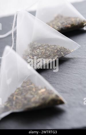 Triangular teabag with tea on a slate Stock Photo