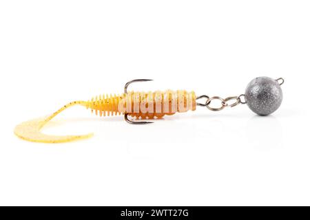 Soft fishing bait, silicone grub, with double hook and lead sinker, isolated on white background Stock Photo