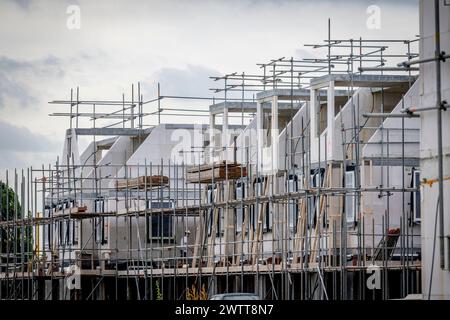 Construction site bustling with scaffolding and emerging structures. Stock Photo