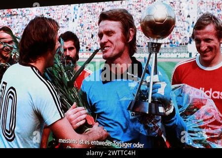 MUNICH, Germany - 19. MARCH 2024: Sepp MAIER, former professional footballer, goalkeeper, celebrated with friends and family and the FcBayern Management his 80th birthday (28th of February) whilst the opening of a special and attractive Exhibition on March 19th at Allianz Arena. HISTORIC IMAGE DISPLAYED in the MOVIE shown during the opening of the Exhibit. Fc Bayern Muenchen created a Sepp MAIER exhibition in the Museum Pavillion at the Allianz Arena in Munich and attended the grand opening. Football keeper Sepp Maier became 80 years and celebrated with Family, Friends, former players and the Stock Photo