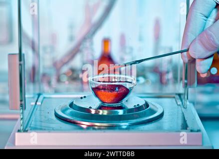 Scientist conducting a chemical experiment in a laboratory Stock Photo