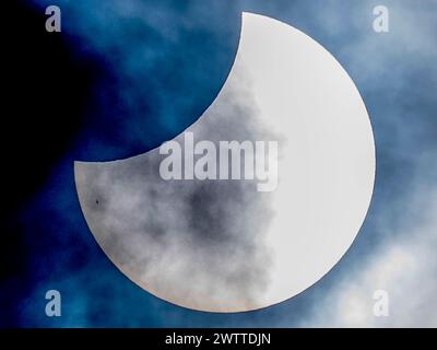 A captivating partial solar eclipse adorned the sky. Stock Photo