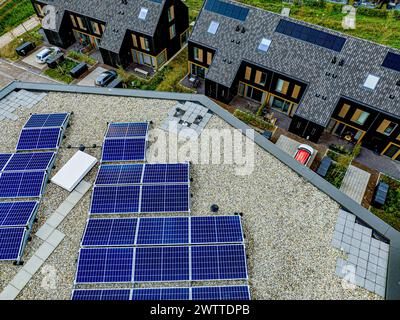 A sustainable living community featuring solar panels on roofs Stock Photo