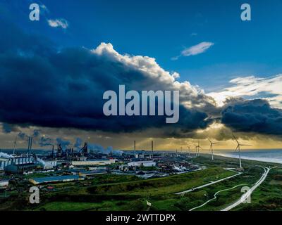 Industrial landscape under a dramatic stormy sky at sunset Stock Photo
