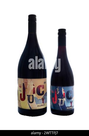Peter Juicy Gajewski showing difference in size between magnum bottle of red wine and 75cl bottle isolated on white product of Australia, Australian Stock Photo