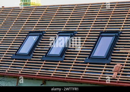 Replacement of house roof structures and installation of new skylights, new roof windows, wooden lathing Stock Photo