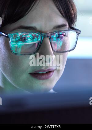 AI Engineering, Female STEM engineer using artificial intelligence to design micro electronics in the lab. Stock Photo