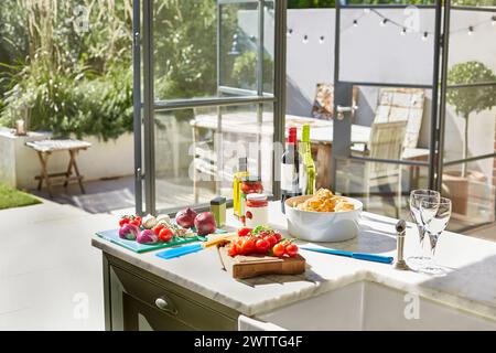 Modern kitchen with food preparation in progress. Stock Photo