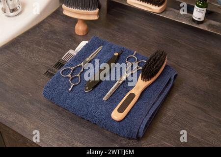 Barber tools laid out on a blue towel Stock Photo