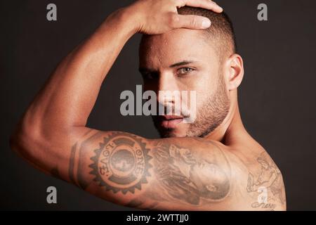 Man with tattoos posing Stock Photo