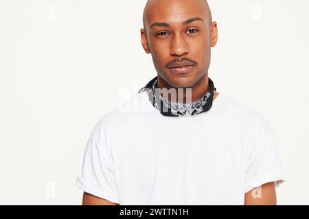 Man in white t-shirt with bandana Stock Photo