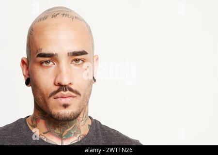 Portrait of a tattooed man on a white background Stock Photo